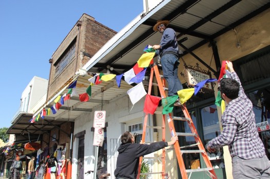 Prayer flags are going up around the city in anticipation of the Dalai Lama's visit.