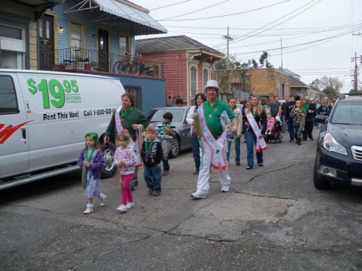 The Downtown Irish Club leads a pre-St. Patrick's Day parade on Sunday.