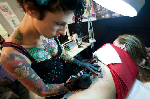 The prevalence of women in the tattoo industry, along with larger numbers of women bearing tattoos, appears to be changing negative perceptions of tattoos. 