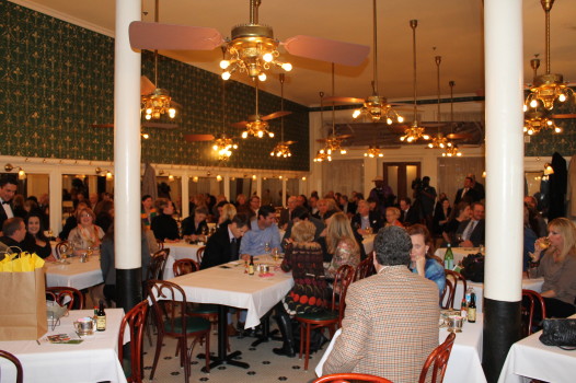 Monday night, crowds bid on reserved tables at Galatoire's for Lundi Gras. (Photo: Caitlin Switzer/The Ehrhardt Group)