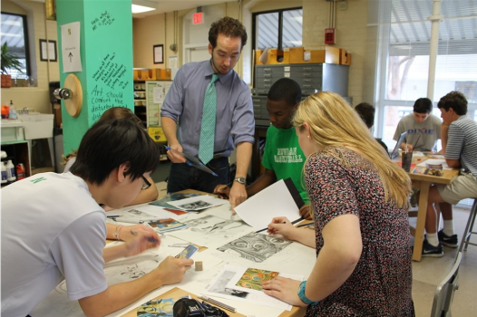 Dean of the Arts Andrew Rodgers, center, works with Isidore Newman students.
