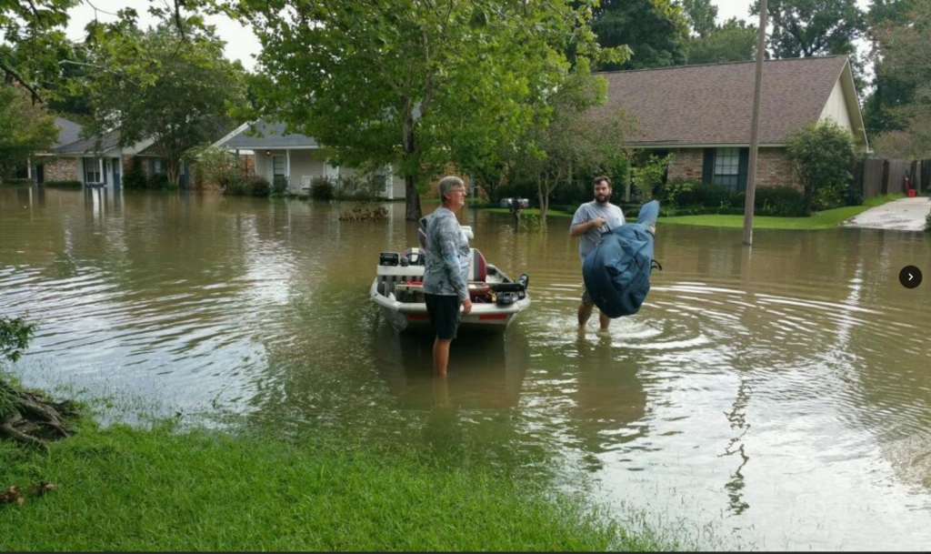 Baton Rouge Orchestra musician rescues his bass after the flood. (Photo: Paul Mauffray)