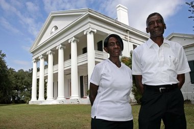 Warren Freeman and his sister, Carolyn Nora, in front of Madewood.