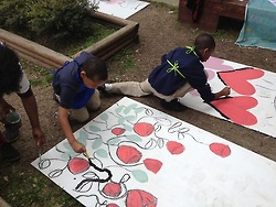 KIPP Central students get in on the house panel project.