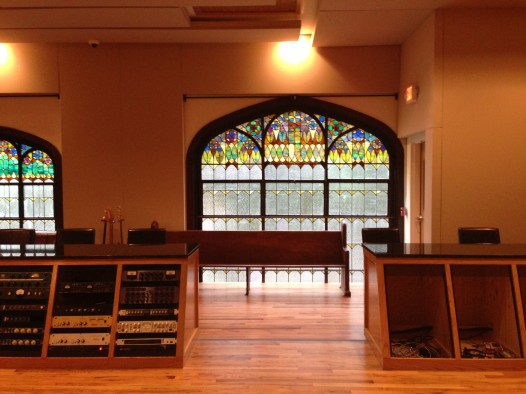 The stained glass windows int he control room -- the former choir loft -- are a unique feature at Esplanade. 