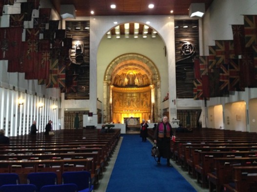 Regimental flags, dramatic sculpture and the surviving 1838 apse at London's contemporary Guards Chapel (Millie Ball)