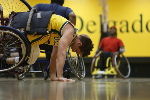 Carrier rights his chair after a collision. (Photo by Ian Cook)