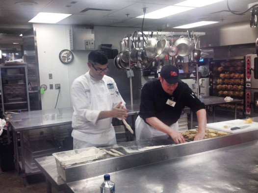 Chef Schubert preparing items for Café Adelaide's St. Jospeh's Day alter, with the help of Rouses. 