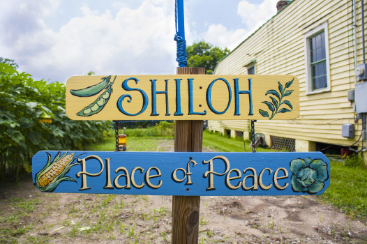 The beautiful, hand-painted sign for Ellis's garden. (Photo by: Hanna Rasanen)