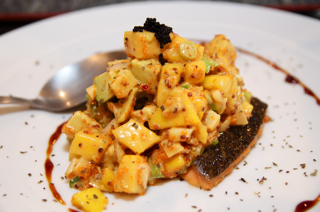 Crispy salmon topped with mango, avocado, caviar and a Dijon mustard sauce.