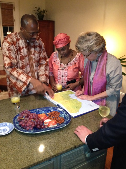 A NODC member with two visitors from Africa at a home hospitality meal, at which members host international visitors in their homes for dinner. Photo: NODC