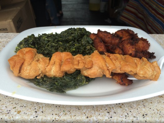 Skinless, boneless chicken breasts and the sautéed spinach at Benachin’s Jama Jama booth. (photo: Summer Suleiman)