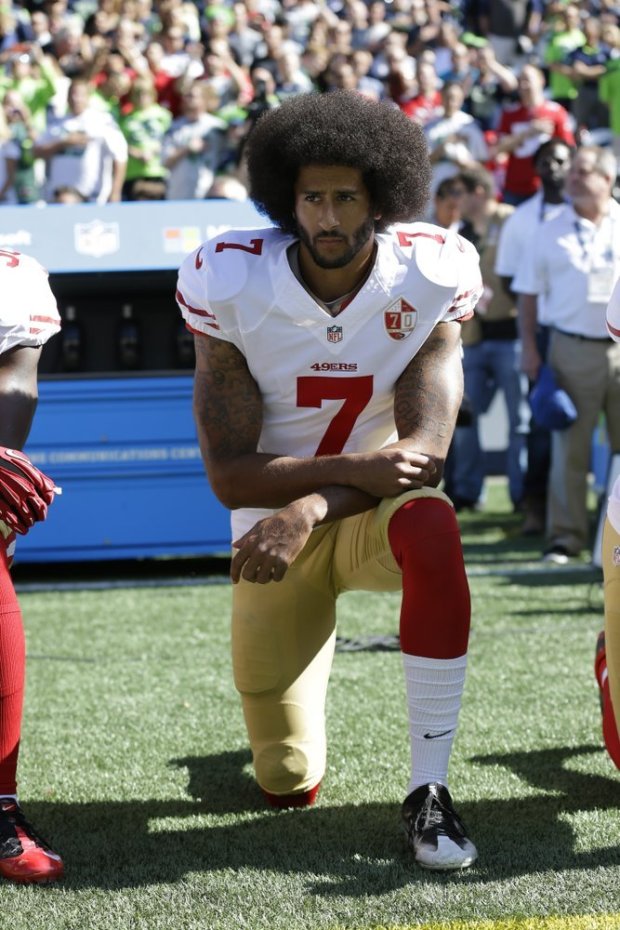 Colin Kaepernick kneeling during the National Anthem
